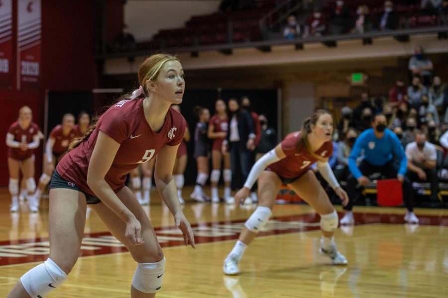 WSU setter Hannah Pukis (9) and outside hitter Pia Timmer (7) prepare for an incoming spike during a college volleyball match against UCLA on Oct. 3, 2021, in Pullman.