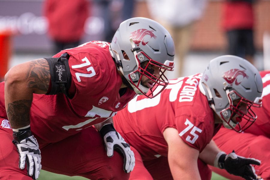 Washington State University linemen Abraham Lucas (72) and Cade Beresford (75) prepare for the snap during a college football game at Martin Stadium, Saturday, Oct. 9, 2021, in Pullman, Wash.