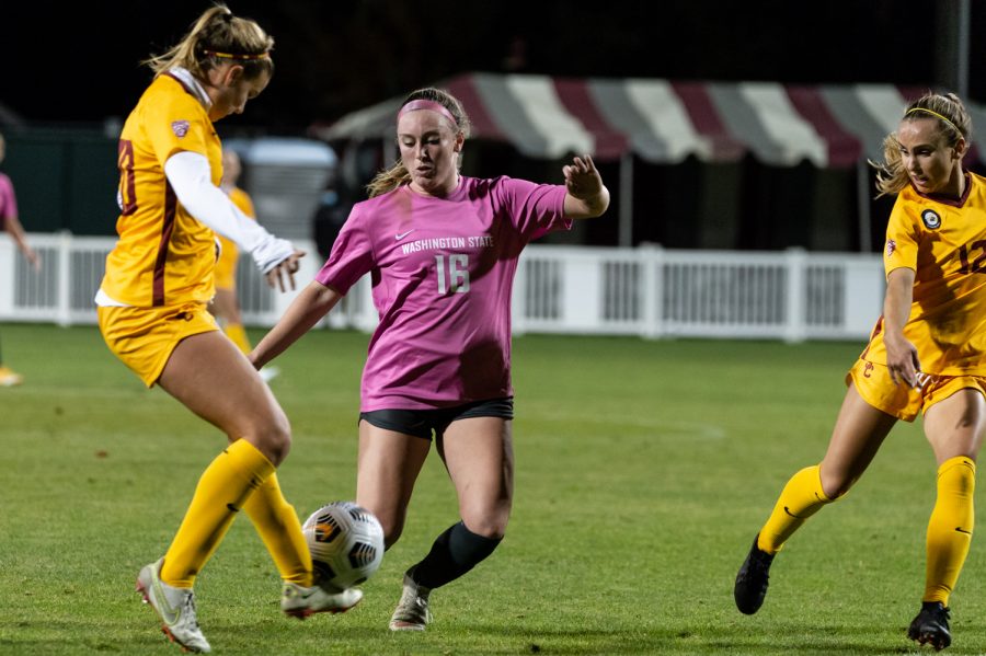 WSU forward Alyssa Gray (16) challenges a USC player for the ball during a college soccer match, Oct. 21, at the Lower Soccer Field in Pullman.