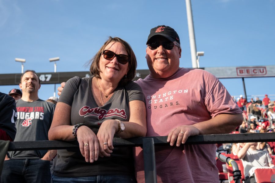 Julie and Steve Wynar watch a Cougar football game during Family Weekend, Saturday, Oct. 16, 2021, in Pullman, Wash.