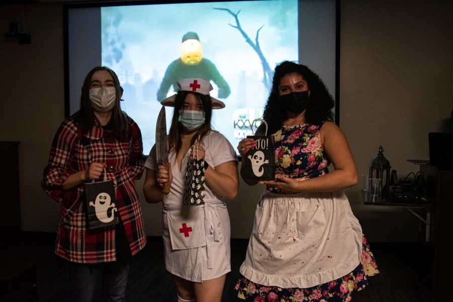 Third-place winner Renee Roulo (left), second-place winner Donata Tran (middle) and first-place winner Izabella Meza (right) pose for a picture after speaking at SpookyEscapes.