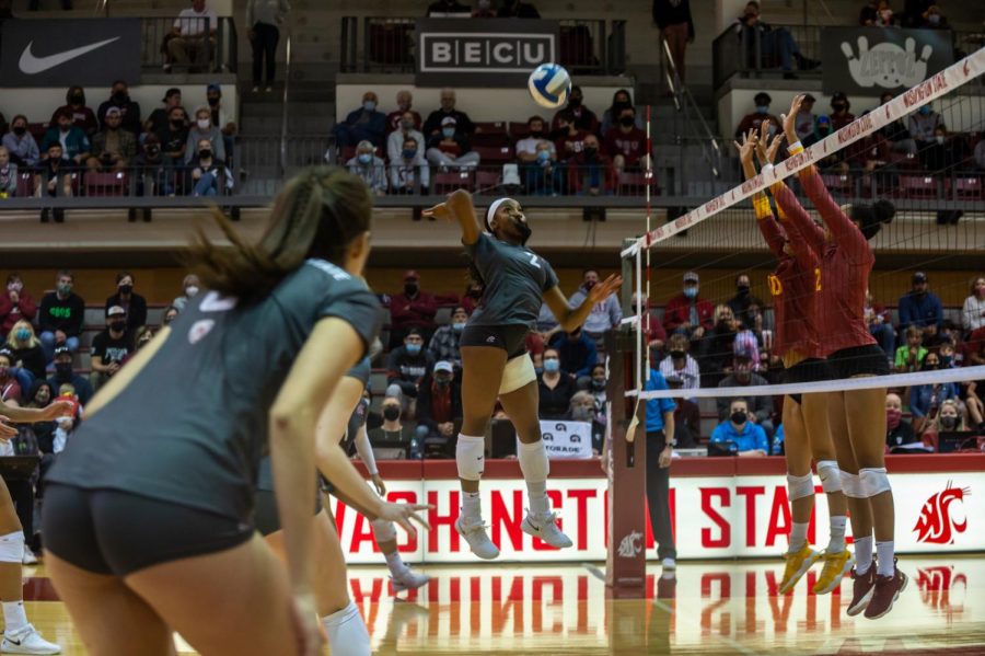 WSU+middle+blocker+Kalyah+Williams+%282%29+spikes+the+ball+during+a+college+volleyball+match+against+USC+on+Oct.+1+in+Pullman.