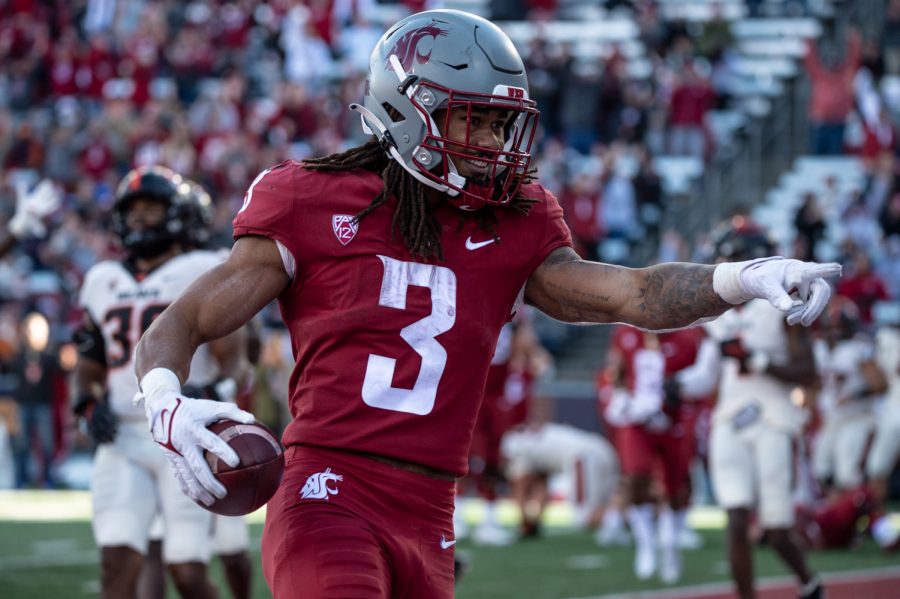 Washington State University running back Deon McIntosh (3) celebrates a touchdown during a college football game at Martin Stadium, Saturday, Oct. 9, 2021, in Pullman, Wash.