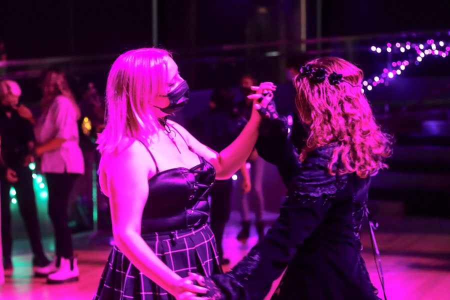 WSU freshmen Hannah Smith and McKenzie Nolan dance at Queer Prom on Oct. 20, 2021, in Pullman.