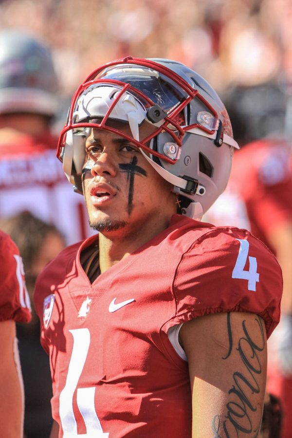 Washington State University quarterback Jayden de Laura (4) watches from the sidelines during a college football game at Martin Stadium, Saturday, Oct. 9, 2021, in Pullman, Wash.