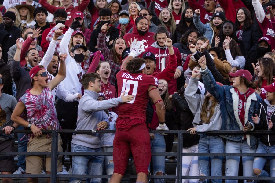 WSU defensive edge Ron Stone Jr. (10) celebrates with fans after a win at a college football game  on Oct. 9, 2021, at Martin Stadium in Pullman.