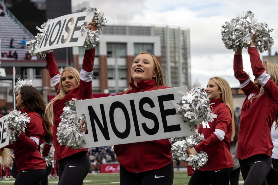 The Washington State University Cheer Squad encourages the crowd to get loud during the second half of a college football game at Martin Stadium, Saturday, Oct. 23, 2021, in Pullman, Wash.