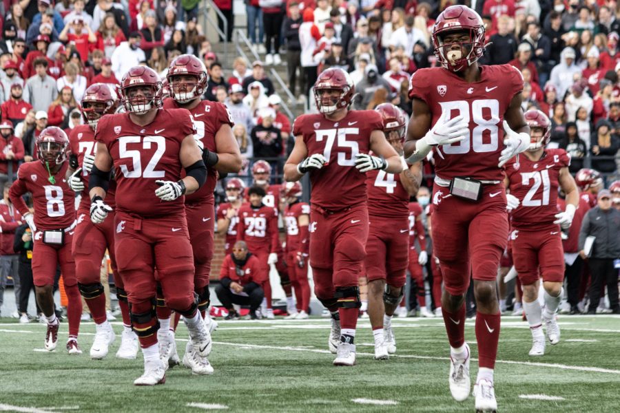 The WSU offense runs back to the sideline during the second half of a college football game, Saturday, Oct. 23, 2021, at Martin Stadium in Pullman.