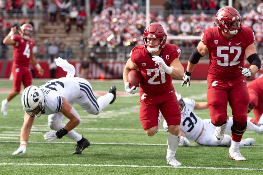 WSU running back Max Borghi (21) runs toward the endzone during the first half of a college football game on Oct. 23, 2021, at Martin Stadium.