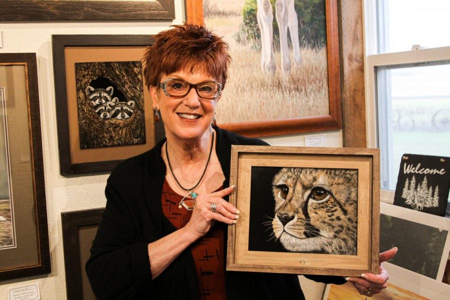 Artist Judy Fairley with the cheetah cub scratchboard she’ll be teaching a workshop on this weekend.