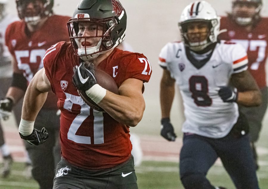 WSU running back Max Borghi (21) runs towards the endzone during a college football game against the University of Arizona at Martin Stadium, Friday, Nov. 19, 2021, in Pullman, Wash.