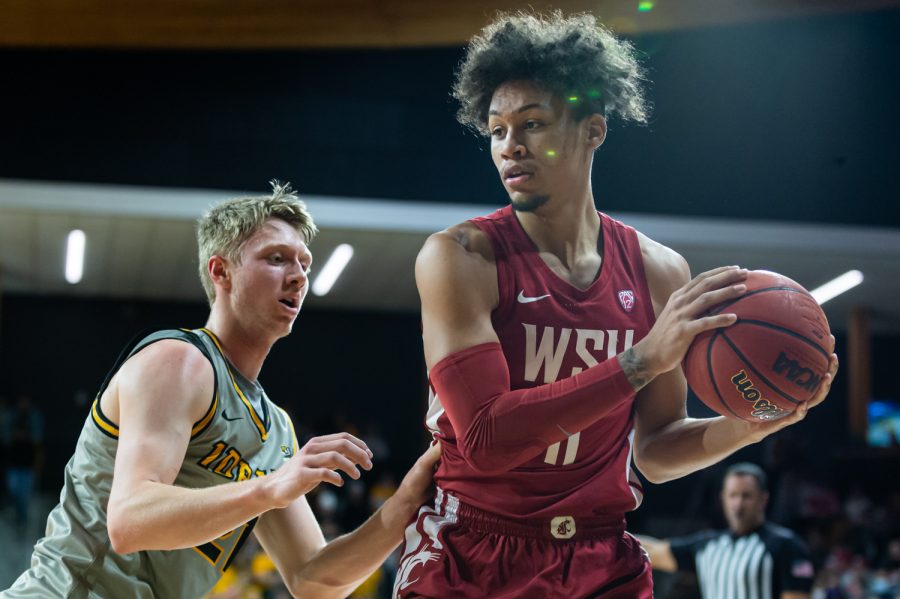 WSU forward DJ Rodman (11) protects the ball from University of Idaho guard Gabe Quinnett (21) during a college basketball game, Thursday, Nov. 18, 2021, in Moscow, Idaho.