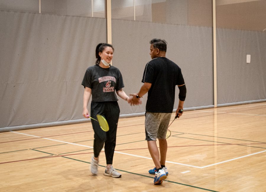 Sreejith Thankappan and Louise Dong shake hands during a mixed doubles match at the WSU Badminton Touranment, Saturday, Nov. 13, 2021, in Pullman.