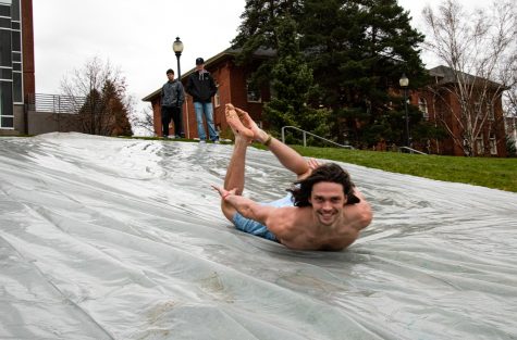 Mitchel Ivory-Saunders slides down Thompson Flats at the Frozen Friday event on Nov. 12, 2021, in Pullman.