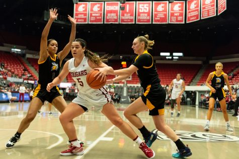 WSU guard Charlisse Leger-Walker (5) dribbles towards the hoop during a college basketball game against San Jose State University, Tuesday, Nov. 9, 2021, in Pullman.