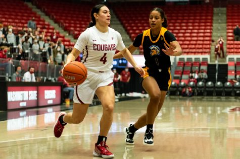 WSU guard Krystal Leger-Walker (4) dribbles towards the hoop during a college basketball game against San Jose State University, Tuesday, Nov. 9, 2021, in Pullman.