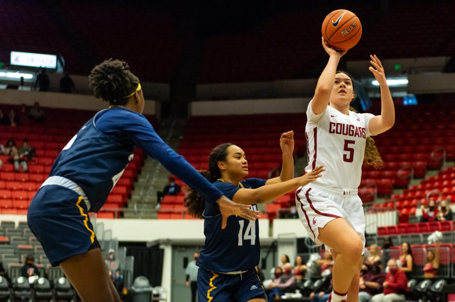 WSU guard Charlisse Leger-Walker (5) jumps for a layup during a college basketball game against Northern Arizona University on Nov. 12, 2021, at Beasley Coliseum. 