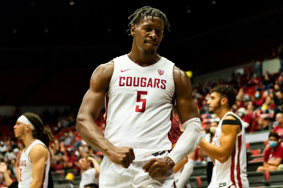 WSU guard TJ Bamba flexes his muscles during a college basketball game against Seattle University at Beasley Coliseum, Friday, Nov. 12, 2021, in Pullman.