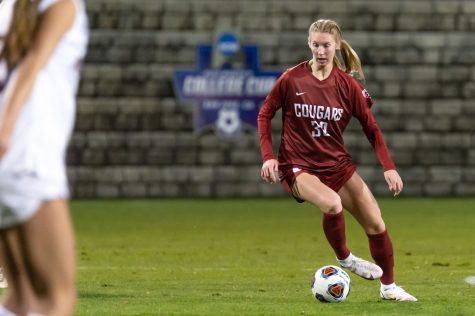 WSU midfielder Sydney Studer (30) dribbles the ball downfield during an NCAA Tournament match against the University of Montana at Lower Soccer Field, Saturday, Nov. 13, 2021, in Pullman.