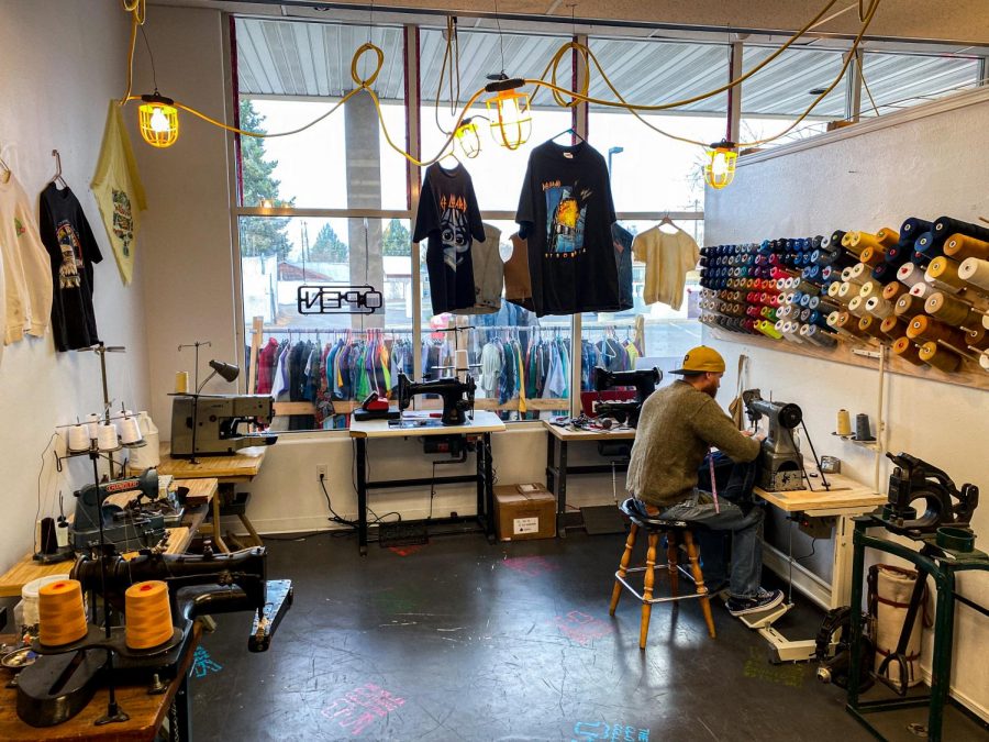 Co-founder Patrick Brown-Hayes works at his sewing machine at the Killer Clothing Collective in Lewiston, Idaho. 