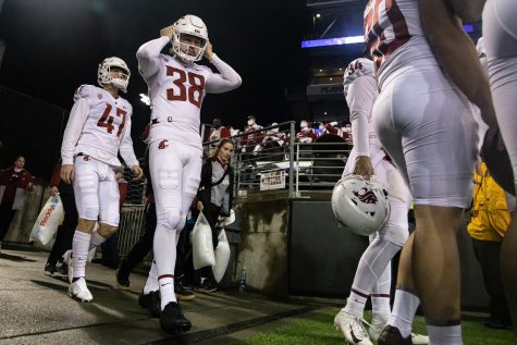 WSU punter Nick Haberer (38) walks out onto the field before the Apple Cup, Friday, Nov. 26, 2021, at Husky Stadium in Seattle.
