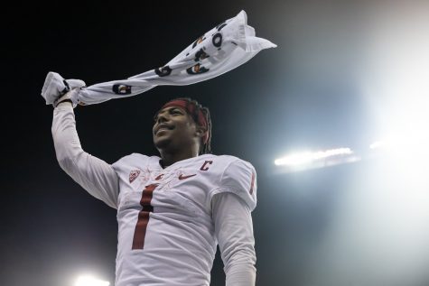 WSU wide receiver Travell Harris waves his towel in the air during the Apple Cup at Husky Stadium, Friday, Nov. 26, 2021, in Seattle.