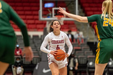WSU guard Krystal Leger-Walker (4) looks to pass the ball during a college basketball game against the University of San Francisco in Beasley Colliseum, Dec. 3, 2021.