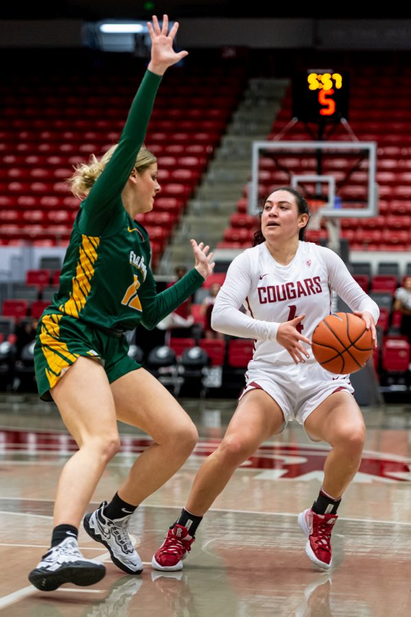 WSU guard Krystal Leger-Walker (4) attempts to find space to take a shot during a college basketball game against the University of San Francisco in Beasley Colliseum, Dec. 3, 2021.