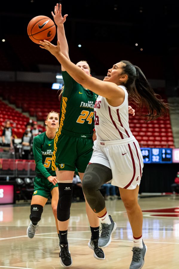 WSU forward Ula Motuga (15) jumps for a layup during a college basketball game against the University of San Francisco in Beasley Coliseum, Dec. 3, 2021, in Pullman.
