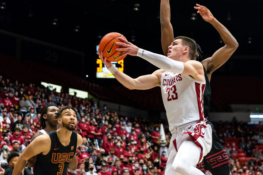 WSU forward Andrej Jakimovski (23) jumps up for a layup during a college basketball game against the University of Southern California at Beasley Coliseum, Saturday, Dec. 4, 2021, in Pullman, Wash.