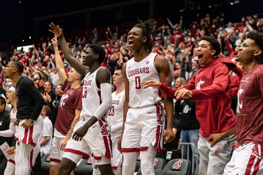 The WSU basketball team celebrates a basket near the end of a tight college basketball game against the University of California at Beasley Coliseum, Saturday, Dec. 4, 2021, in Pullman, Wash.