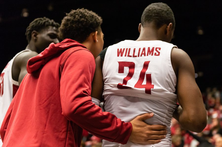 WSU guard Myles Rice consoles teammate Noah Williams (24) after losing to the University of Southern California 61-63 at Beasley Coliseum, Saturday, Dec. 4, 2021, in Pullman, Wash.
