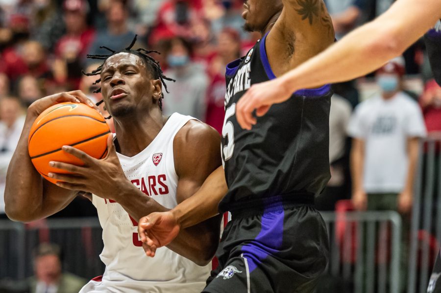 WSU guard TJ Bamba (5) prepares to jump for a layup during a college basketball game against Weber State University at Beasley Coliseum, Wednesday, Dec. 8, 2021.