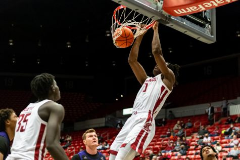 WSU forward Efe Abogidi (0) dunks the ball during a college basketball game against Weber State University at Beasley Coliseum, Wednesday, Dec. 8, 2021, in Pullman.
