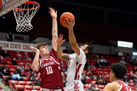 Stanford University forward Max Murrell (10) attempts to block a layup by WSU guard Michael Flowers (12) during the first half of an NCAA college basketball game, Thursday, Jan. 13, in Beasley Coliseum.