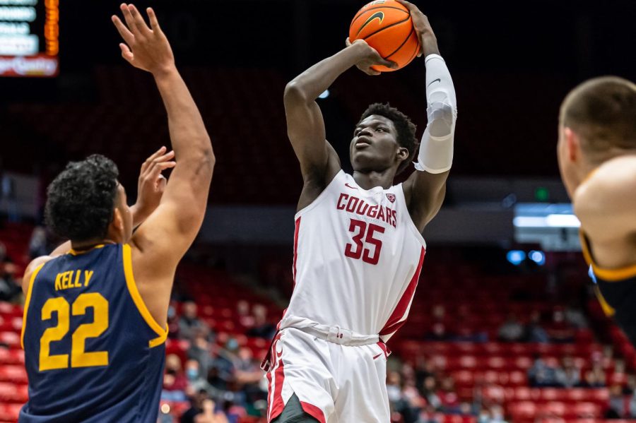 WSU forward Mouhamed Gueye (35) shoots over California forward Andre Kelly (22) during the first half of an NCAA college basketball game, Saturday, Jan. 15, in Beasley Coliseum.