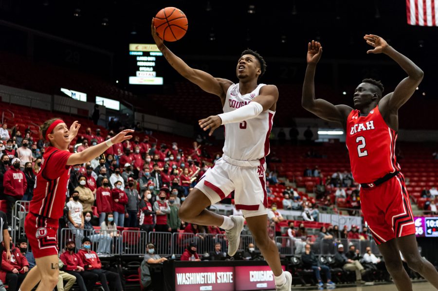 WSU guard Jefferson Koulibaly (middle) drives toward the basket during the second half against Utah, Wednesday, Jan. 26, in Beasley Coliseum.