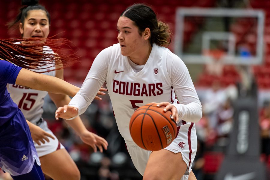 WSU guard Charlisse Leger-Walker drives toward the basket during the second half of an NCAA collegiate basketball game against UW, Friday, Jan. 28, in Beasley Coliseum.