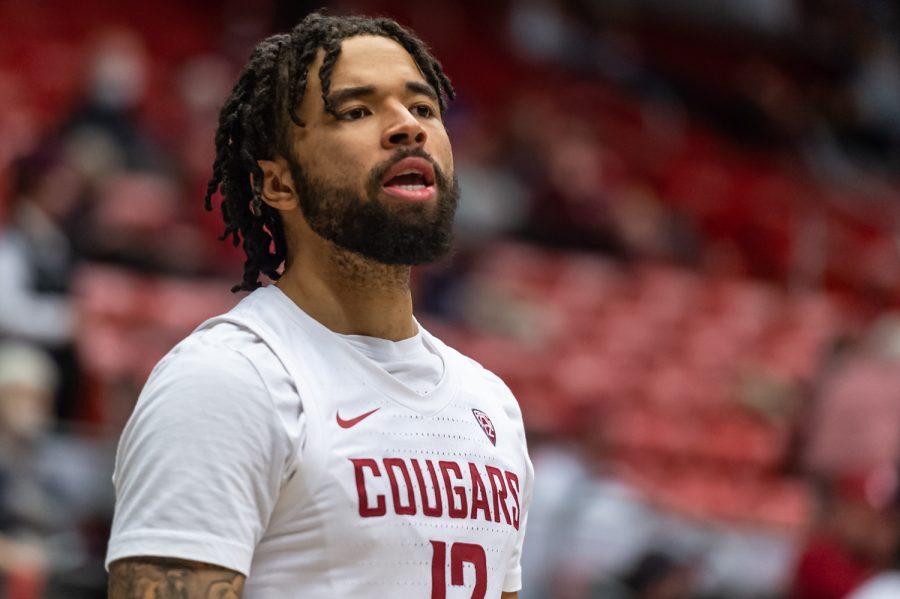 WSU guard Michael Flowers (12) talks to a teammate during a warmup before the first half of an NCAA college basketball game against Stanford, Thursday, Jan. 13, in Beasley Coliseum.
