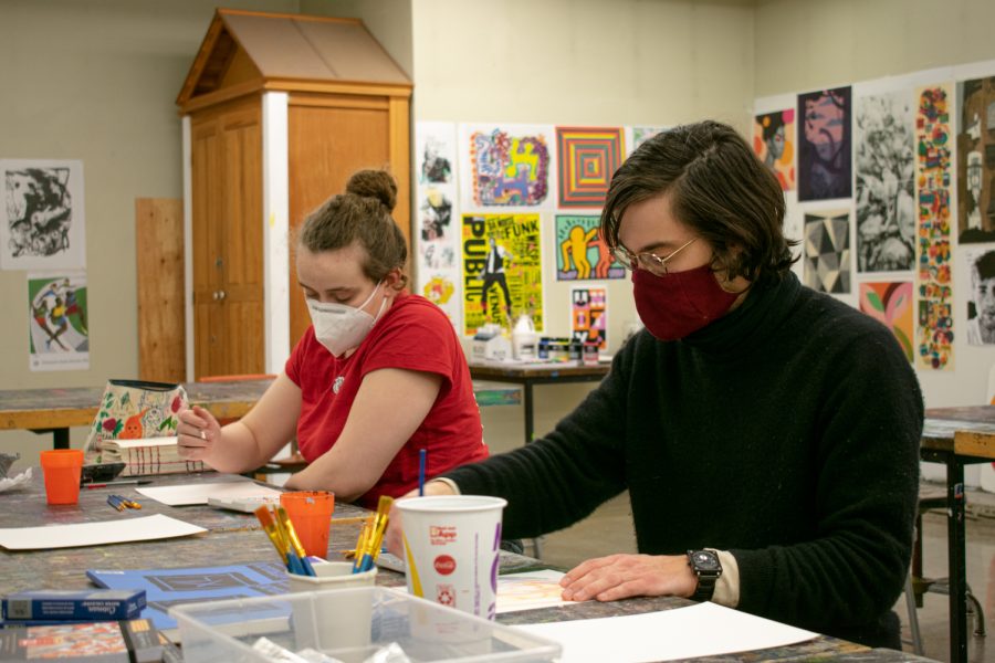 Junior computer science major Cora Hernandez (left) and junior digital technology and culture major Austin Wetzel create watercolor paintings at Cougs for Recovery’s weekly Art Night, Friday, Jan. 28, at the Fine Arts Center. 