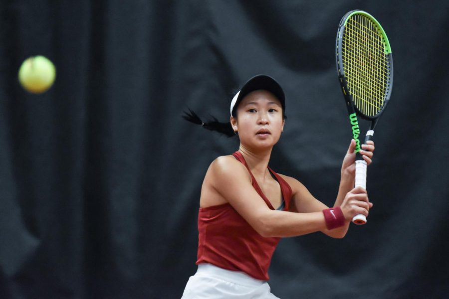 Savanna Ly-Nguyen prepares to strike the ball during a singles match against Idaho, Saturday, Jan. 29, at Hollingbery Fieldhouse.