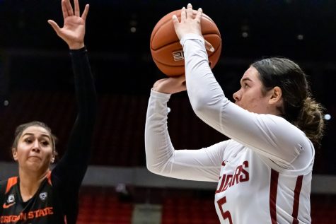 WSU guard Charlisse Leger-Walker (5) shoots a 3-pointer during the second half of an NCAA collegiate basketball game against Oregon State, Wednesday, Jan. 26, in Beasley Coliseum.