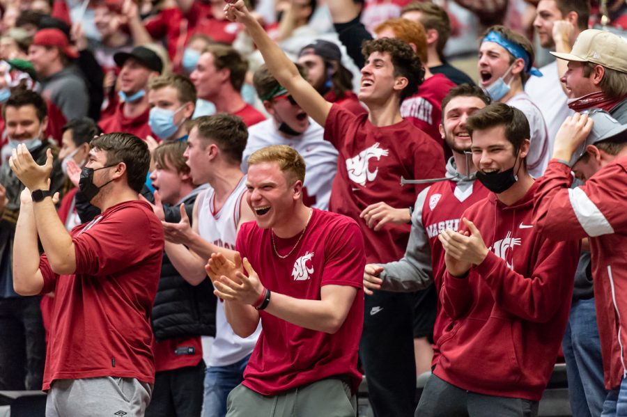 WSU students cheer after a dunk by Mouhamed Gueye during the first half of an NCAA collegiate basketball game against Arizona, Feb. 10.