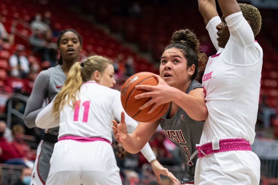 WSU guard Charlisse Leger-Walker drives to the basket during the first half of an NCAA college basketball game against Arizona State in Beasley Coliseum, Feb. 18.