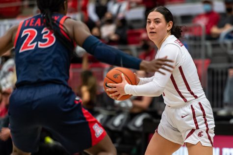 WSU guard Krystal Leger-Walker looks for a pass during the first half of an NCAA college basketball game against Arizona in Beasley Coliseum, Feb. 20.