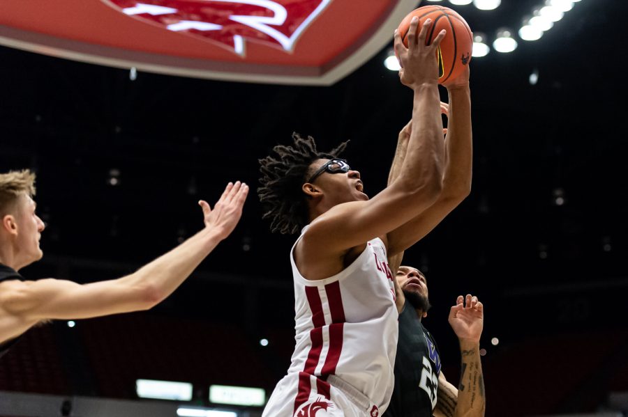 WSU+center+Dishon+Jackson+%28middle%29+jumps+for+a+layup+during+the+second+half+of+an+NCAA+college+basketball+game+against+UW+in+Beasley+Coliseum%2C+Feb.+23.