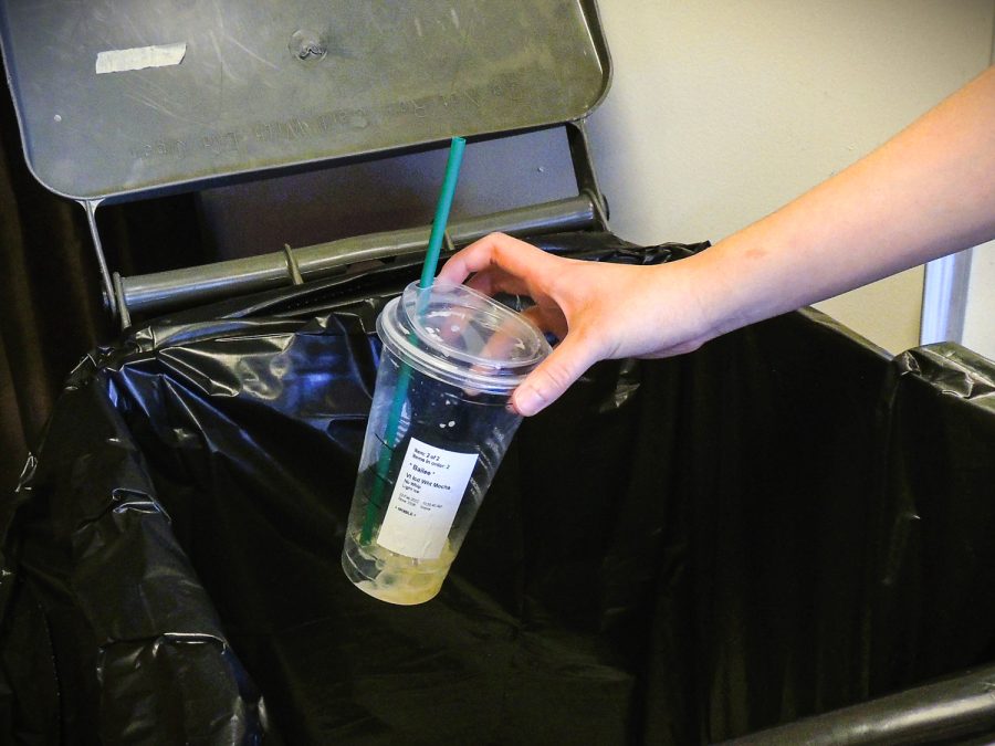 A student throws away a drink in the Compton Union Building, Feb 22.
