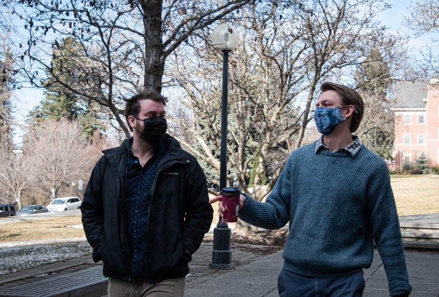 Zach Colligan and John Mccornack having a conversation with mask on outside of Carpenter, Feb. 22.
