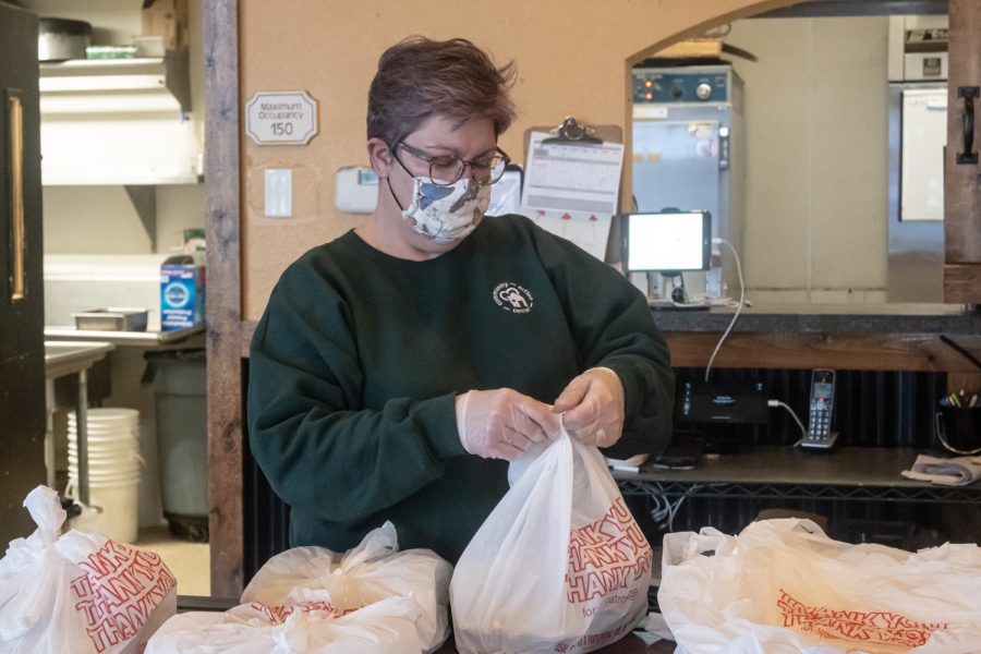 Tahnee Runions, volunteer for Feeding our Friends, prepares free meals for hungry residents of the Pullman community, Oak Pullman, Feb. 22