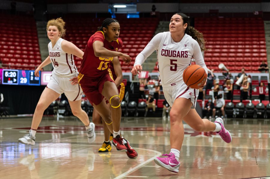 WSU guard Charlisse Leger-Walker (5) dribbles around USC guard Rayah Marshall (13) during the second half of an NCAA college basketball game in Beasley Coliseum, Feb. 13.